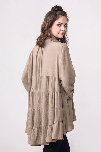 Soft drape and babydoll waistline that accentuate flow over the body.