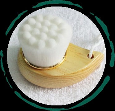 Eco-friendly facial brush with bamboo handle and soft bristles for gentle exfoliation and cleansing

