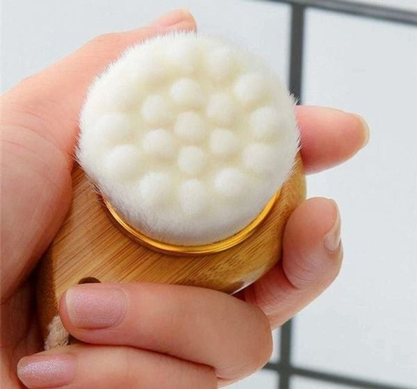 Eco-friendly facial brush with bamboo handle and soft bristles for gentle exfoliation and cleansing

