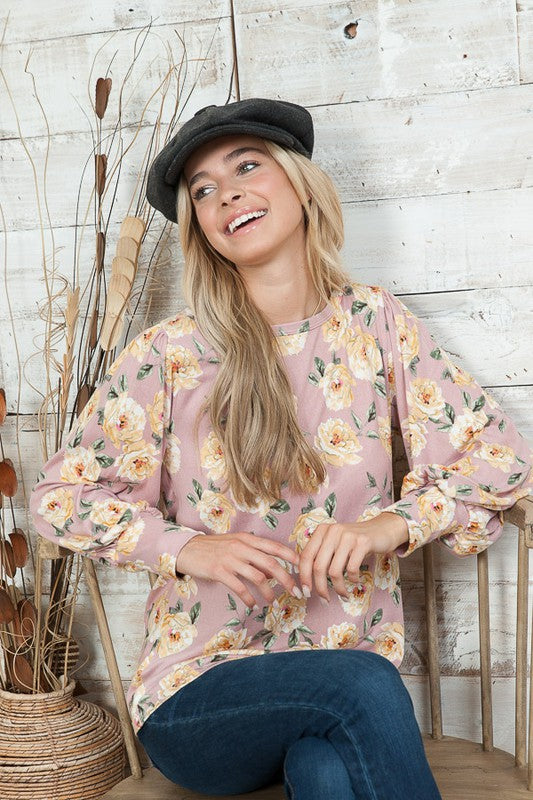 A lightweight knit sweater with chic bell sleeves that adds effortless elegance to any outfit.