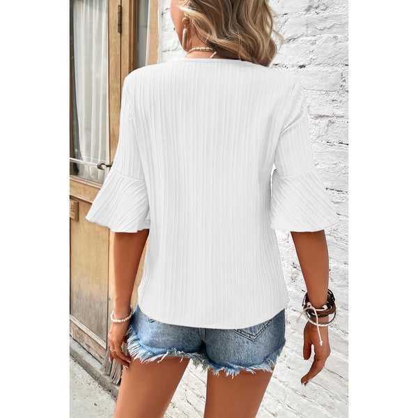 Draped silhouette meets statement sleeves in this airy blouse, you can dress up or down.