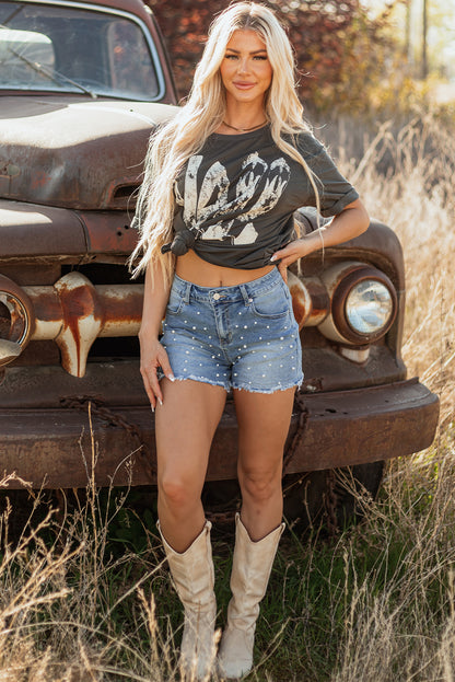 Bold, beaded, and beautifully distressed. These denim shorts are your go-to for effortless edge, featuring raw hems and delicate bead detailing that elevate any casual look.