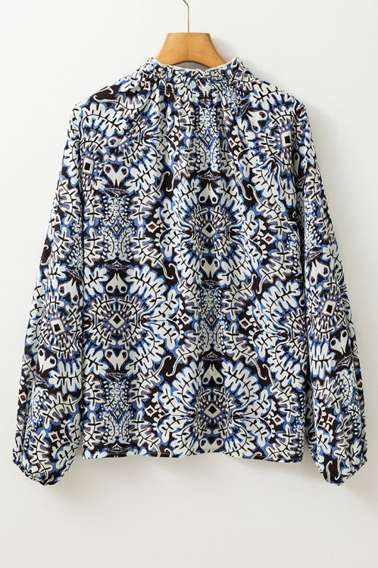 Puff sleeves add drama and elevate this blouse’s silhouette. 