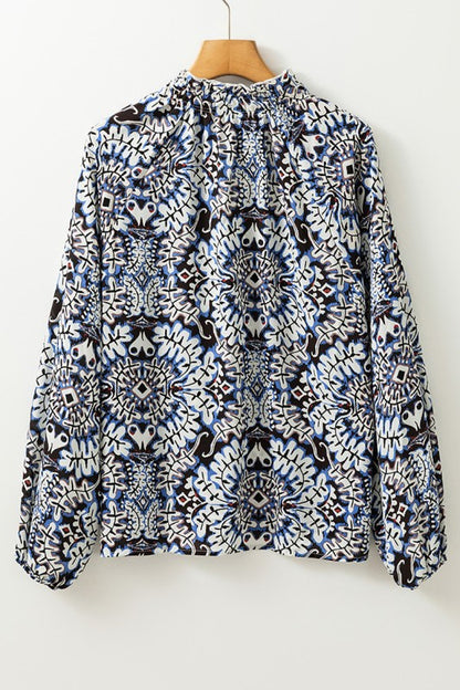 Puff sleeves add drama and elevate this blouse’s silhouette. 