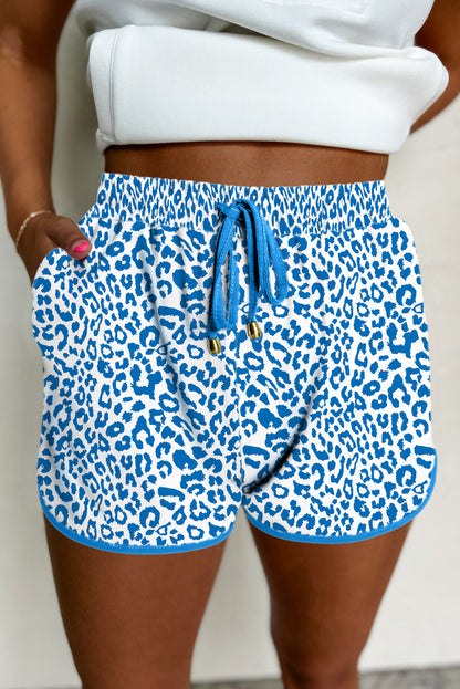 Fierce meets functional. These Blue Leopard Lace-Up Shorts are designed to turn heads with their wild print and sporty silhouette. Featuring a stretchy waistband, lace-up front, and bold contrast trim, they’re perfect for casual days, festival looks, or street-style slayage.