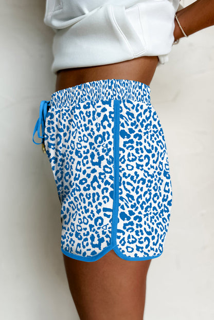 Fierce meets functional. These Blue Leopard Lace-Up Shorts are designed to turn heads with their wild print and sporty silhouette. Featuring a stretchy waistband, lace-up front, and bold contrast trim, they’re perfect for casual days, festival looks, or street-style slayage.