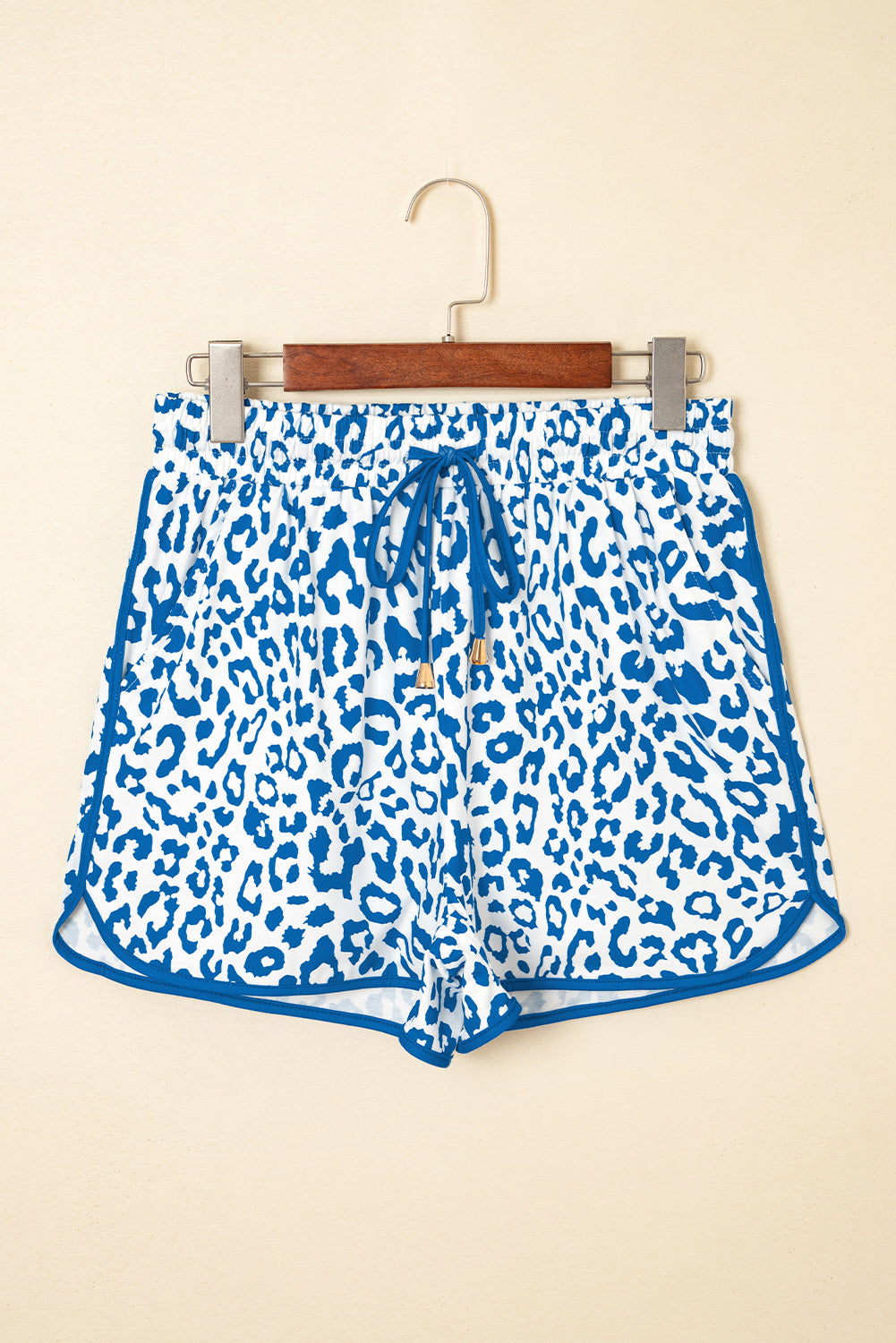 Fierce meets functional. These Blue Leopard Lace-Up Shorts are designed to turn heads with their wild print and sporty silhouette. Featuring a stretchy waistband, lace-up front, and bold contrast trim, they’re perfect for casual days, festival looks, or street-style slayage.