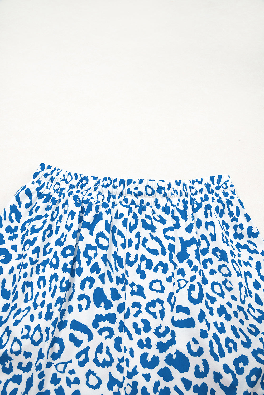 Fierce meets functional. These Blue Leopard Lace-Up Shorts are designed to turn heads with their wild print and sporty silhouette. Featuring a stretchy waistband, lace-up front, and bold contrast trim, they’re perfect for casual days, festival looks, or street-style slayage.