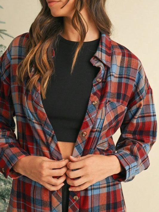 Features a bold red and mint plaid design.