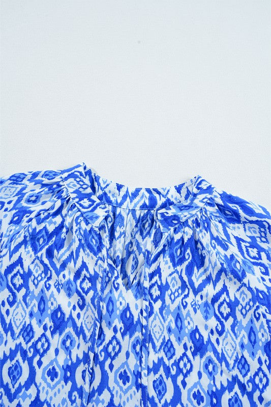 The tie at the neck can be styled loosely or more neatly to change the vibe. (styling suggestion) 