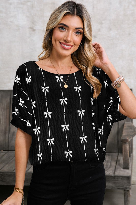 Puff short sleeves for a trendy, feminine look. Bow Print Puff Top colour black