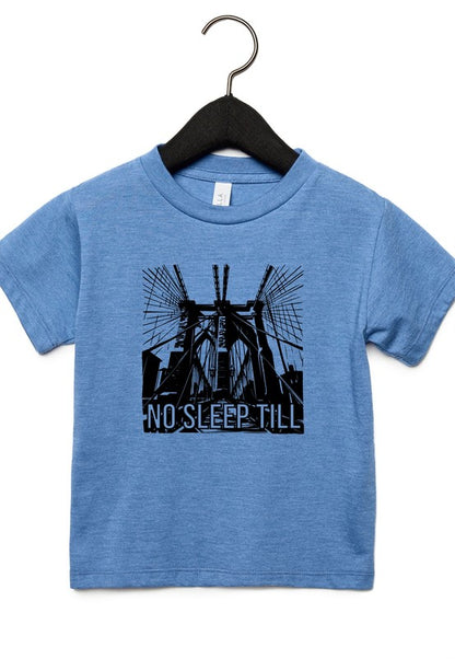 Blue t-shirt with black graphic and 'No Sleep Till' text on a hanger against a white background