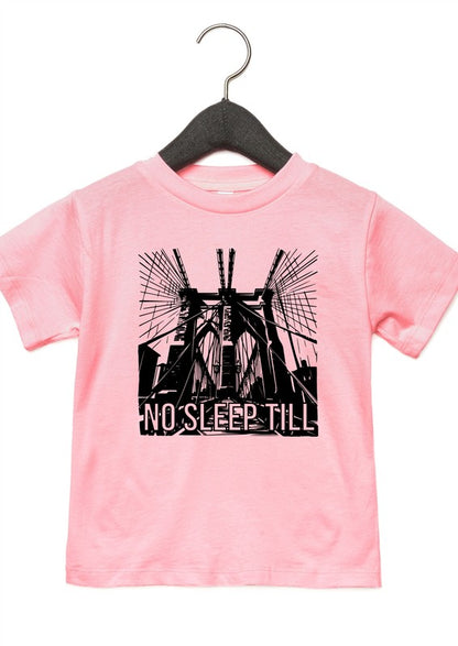 Pink t-shirt with black graphic design and 'No Sleep Till' text on a hanger against a white background
