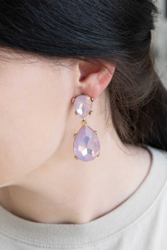 The Briel Drop Earrings in Pink Crystal are designed to add a touch of romance and radiance to any look. With faceted pink stones that catch the light and a sleek drop silhouette, these earrings are perfect for weddings, date nights, or everyday elegance.