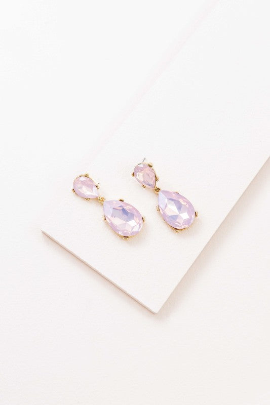 The Briel Drop Earrings in Pink Crystal are designed to add a touch of romance and radiance to any look. With faceted pink stones that catch the light and a sleek drop silhouette, these earrings are perfect for weddings, date nights, or everyday elegance.