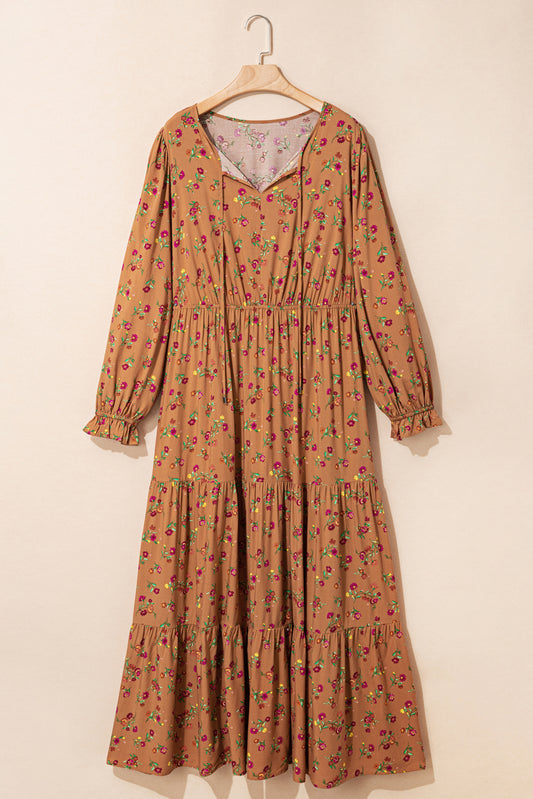 A plus size floral maxi dress with split V-neck and tiered design.