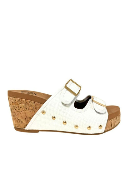 Platform wedge sandals with dual buckle straps, studded detail, open-toe design, cork wedge heel, and slip-on style