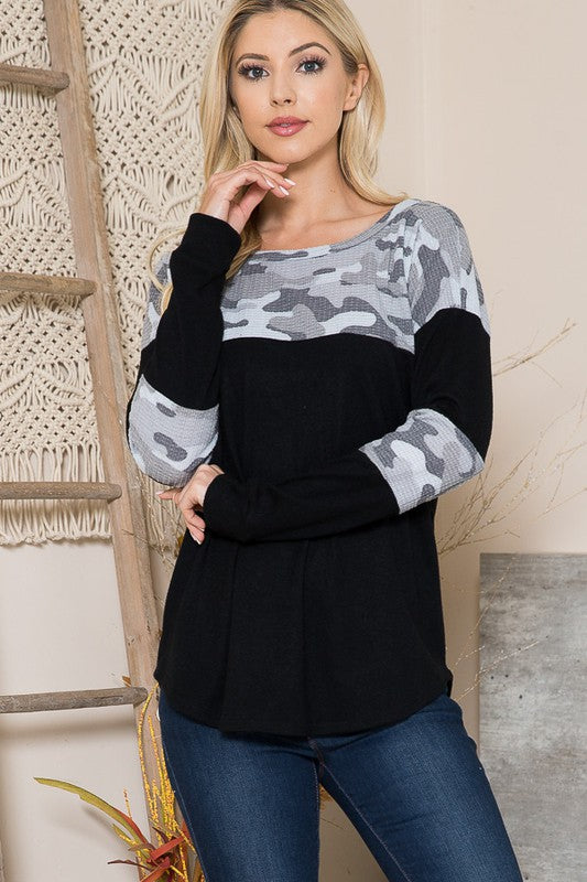 Lightweight knit sweater with textured camo print and contrast panels for added depth.