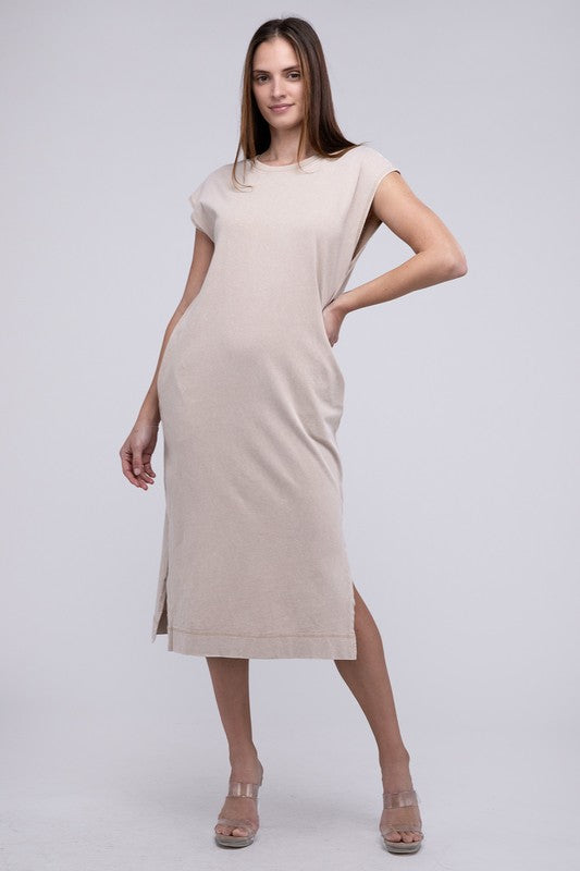 Woman models a comfortable midi dress with a relaxed fit and convenient side pockets, full view.