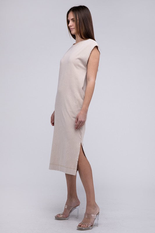 Woman models a comfortable midi dress with a relaxed fit and convenient side pockets, side view.