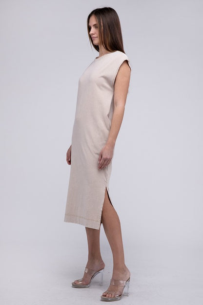 Woman models a comfortable midi dress with a relaxed fit and convenient side pockets, side view.