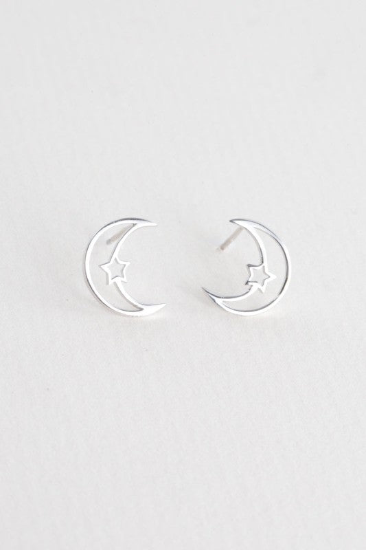 Moonlight meets starlight. The Celestial Unity Earrings in Silver celebrate harmony between cosmic forces. Featuring delicate moon and star motifs in a sleek silver finish, these earrings are perfect for dreamers, stargazers, and anyone drawn to the magic of the night sky.