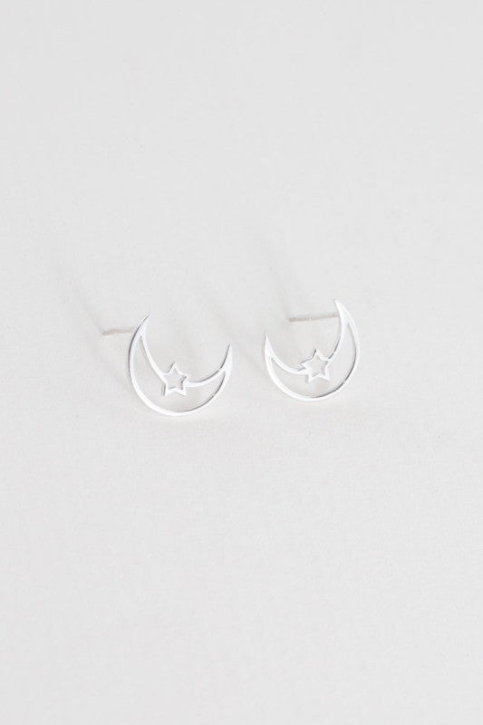 Moonlight meets starlight. The Celestial Unity Earrings in Silver celebrate harmony between cosmic forces. Featuring delicate moon and star motifs in a sleek silver finish, these earrings are perfect for dreamers, stargazers, and anyone drawn to the magic of the night sky.