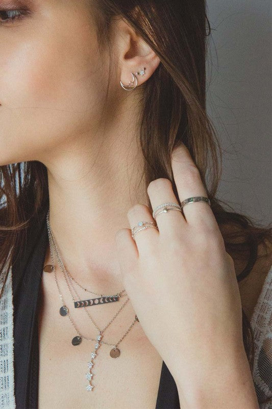 Moonlight meets starlight. The Celestial Unity Earrings in Silver celebrate harmony between cosmic forces. Featuring delicate moon and star motifs in a sleek silver finish, these earrings are perfect for dreamers, stargazers, and anyone drawn to the magic of the night sky.
