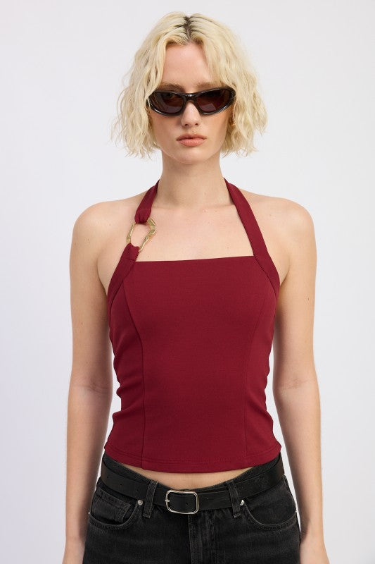 Halter neckline that highlights the shoulders and back. 