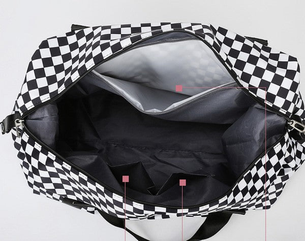 Checkered print duffel bag with a shoulder strap and top handles, ideal for gym or travel.
