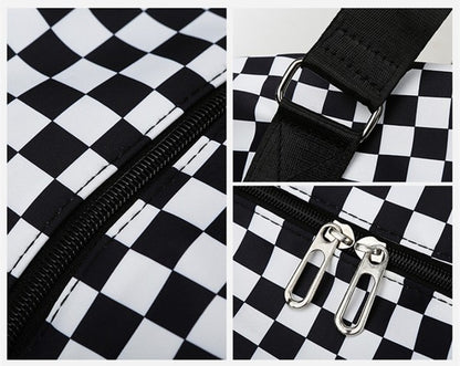 Checkered print duffel bag with a shoulder strap and top handles, ideal for gym or travel.