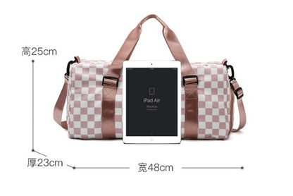 Checkered print duffel bag with a shoulder strap and top handles, ideal for gym or travel.