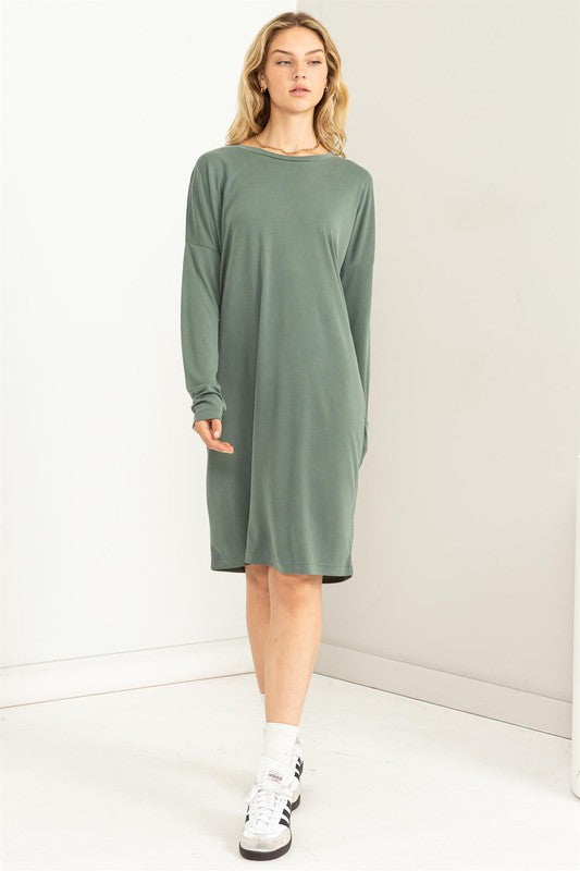 A woman models a comfortable, oversized Midi Dress with a relaxed fit.
