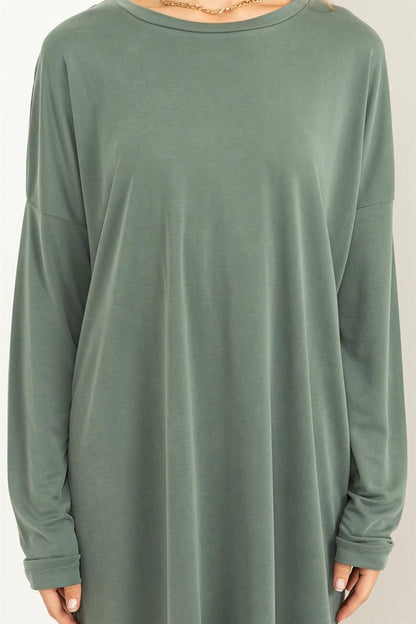 A woman models a comfortable, oversized Midi Dress with a relaxed fit, perfect for casual wear, close up view.