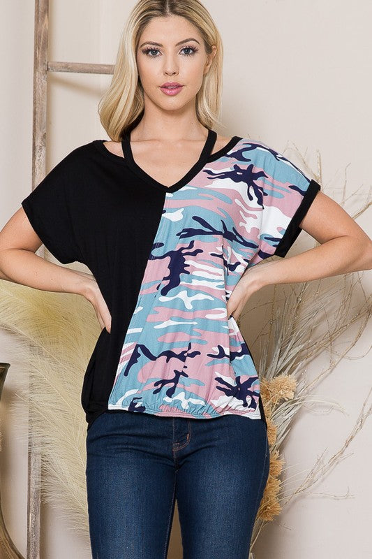This wrap front shirt gives dimension with its shoulder cutouts and crossover look.