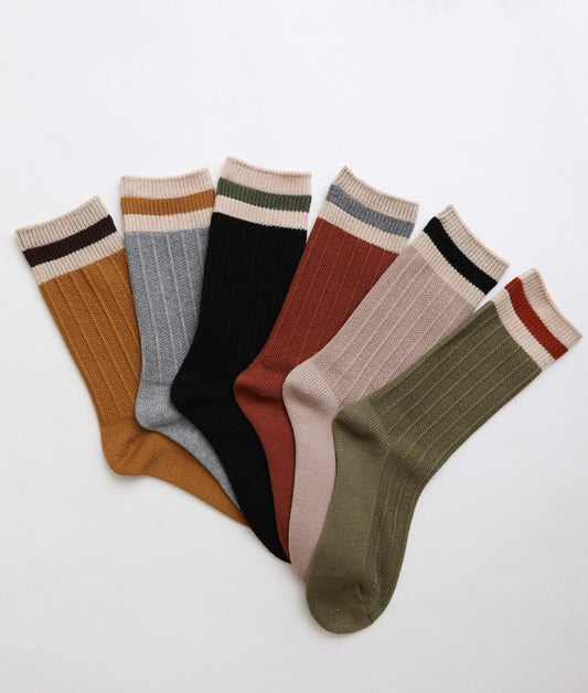 Collection of ribbed crew socks with contrast striped cuffs, offering varied colors for everyday wear.