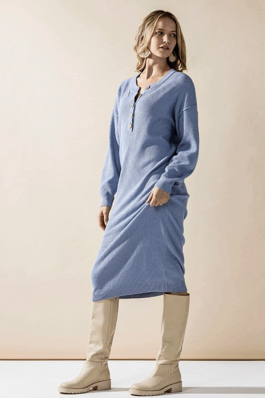 Woman models a light blue comfy button-front soft sweater knit midi dress.