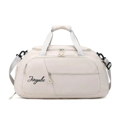 Light beige duffel bag with "Jinyubo" branding, featuring a sleek design with zippered front and side pockets, padded handles, and an adjustable shoulder strap. Stylish and functional—great for travel, gym, or daily use.