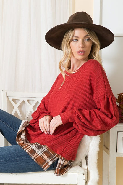 Dramatic balloon sleeves in contrast plaid make this top a statement piece.