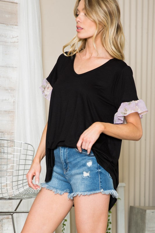 Contrast ruffle sleeves add movement and character to this top.