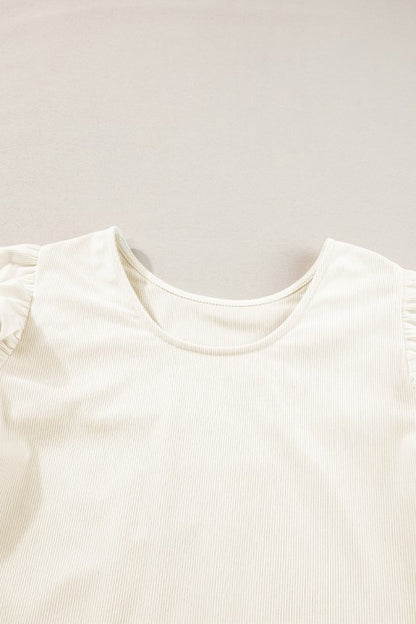 Designed with a flattering round neckline for effortless wear.