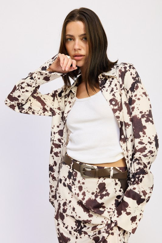 Long sleeves with cuffed ends to balance the glossy sheen. 