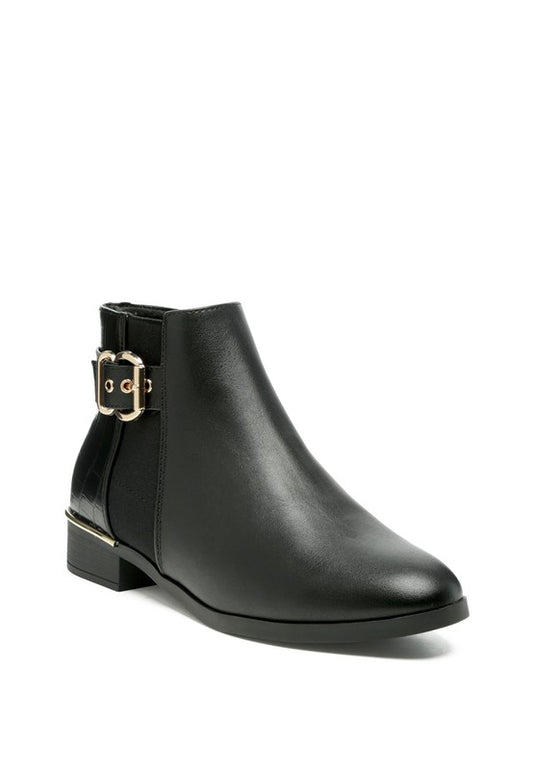 A decorative strap with a gold-tone buckle runs around the outer side near the ankle.