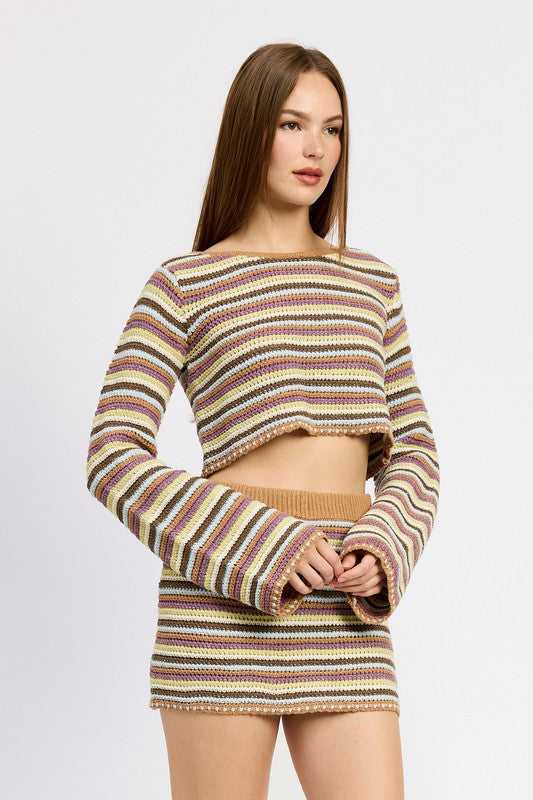 Breathable and stylish, with bell sleeves that add movement to the crochet body.