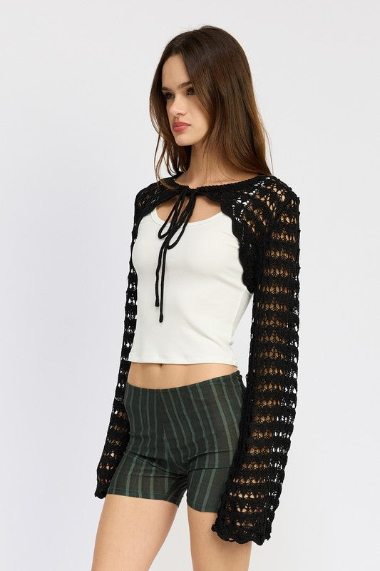 The open knit lets your outfit underneath peek through, adding depth.