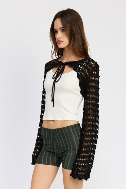 The open knit lets your outfit underneath peek through, adding depth.