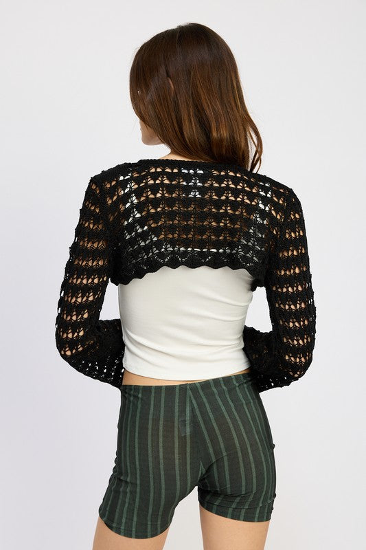 Feminine and flattering, this crochet bolero brings soft structure to any look.