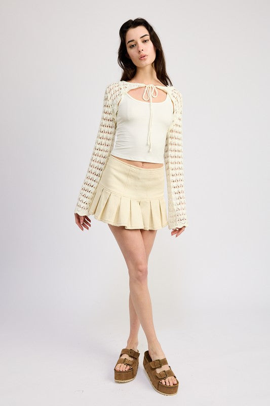 A petite layering piece that adds texture without bulk.