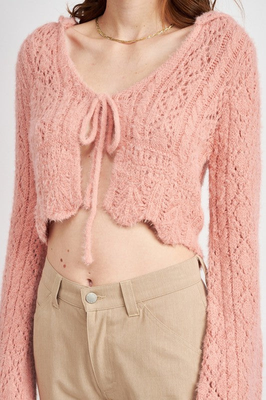 Lightweight and textured — this crop top blends crochet artistry with modern flair.