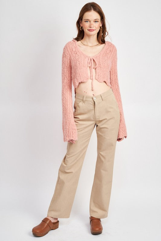 A flattering cropped length meets airy crochet pattern for summer vibes.